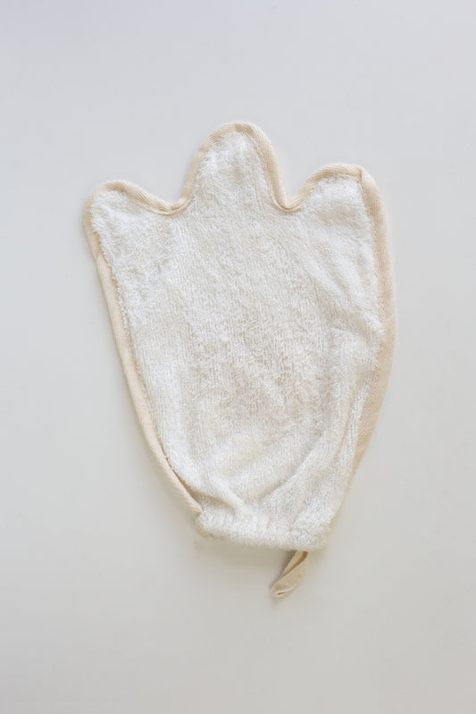 White towel/Mitt/flannal with a ghost shape on a light gray background