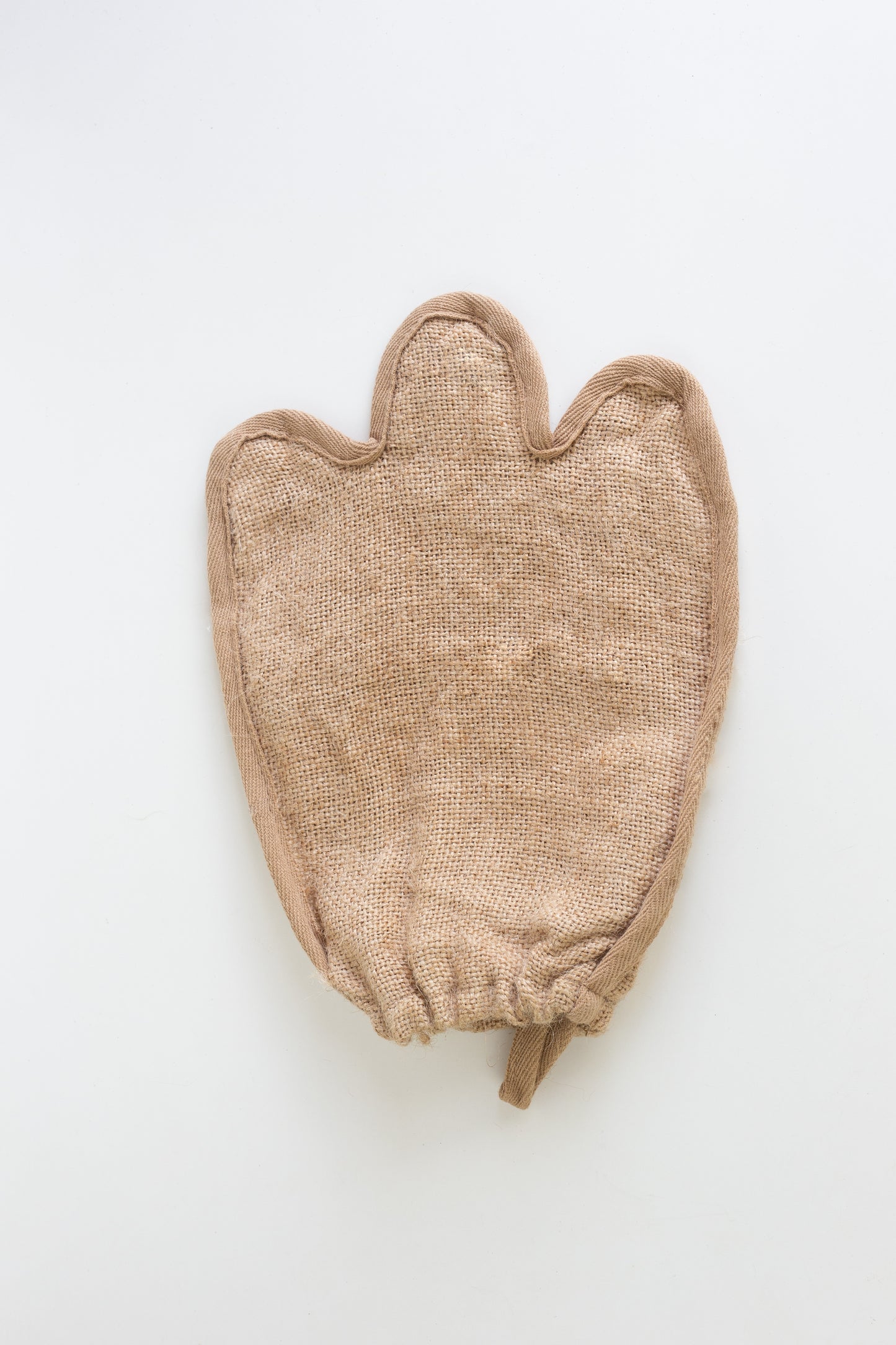 Brown Jute loofah glove on a white background