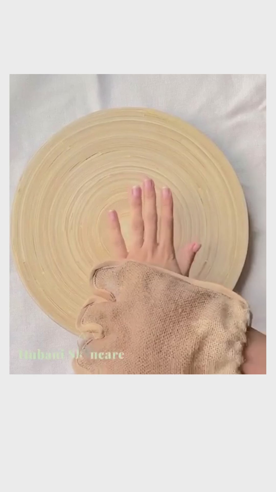 video of jute mitt removing dead skin cells of hand